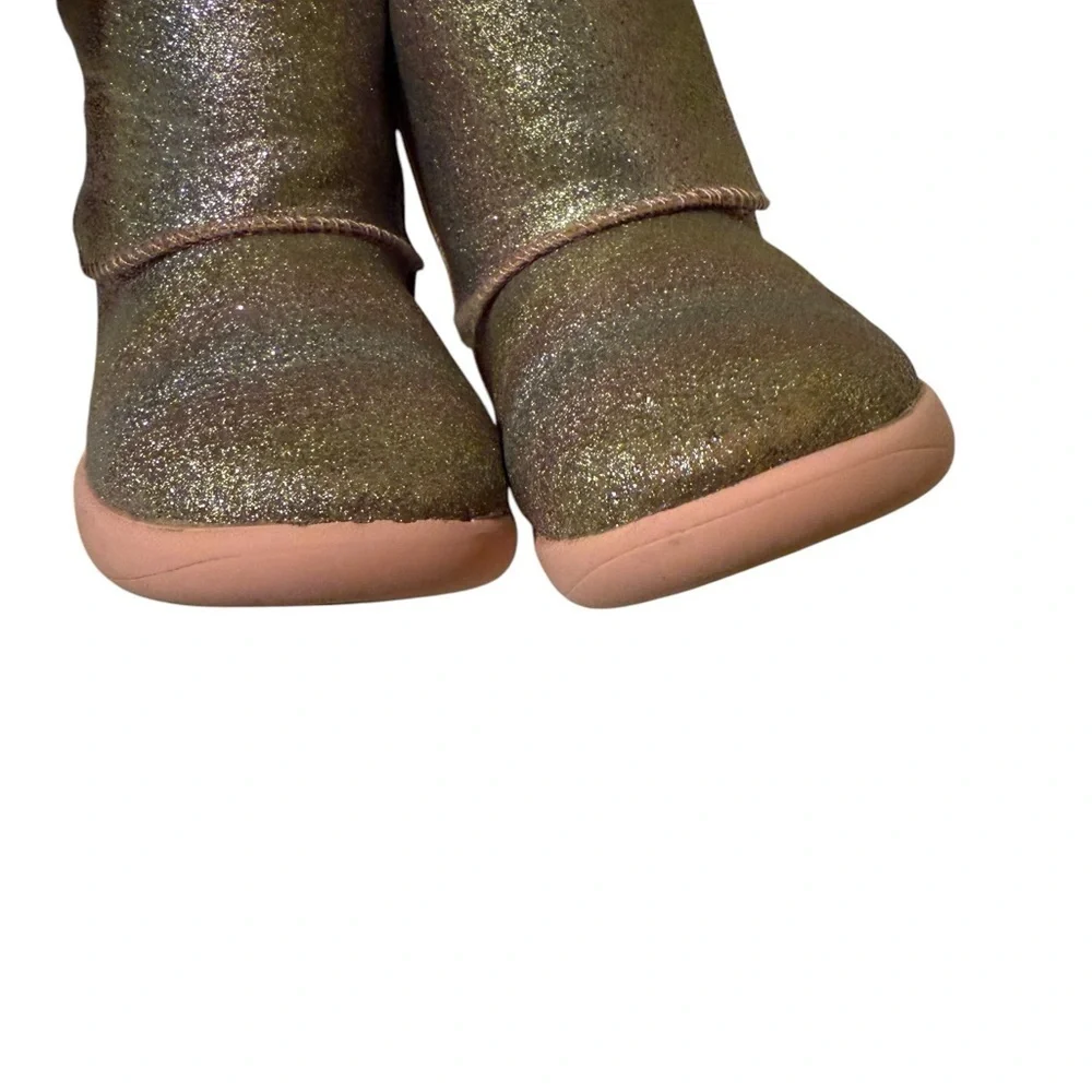 UGG’s Sparkly Gold and Pink Boots.